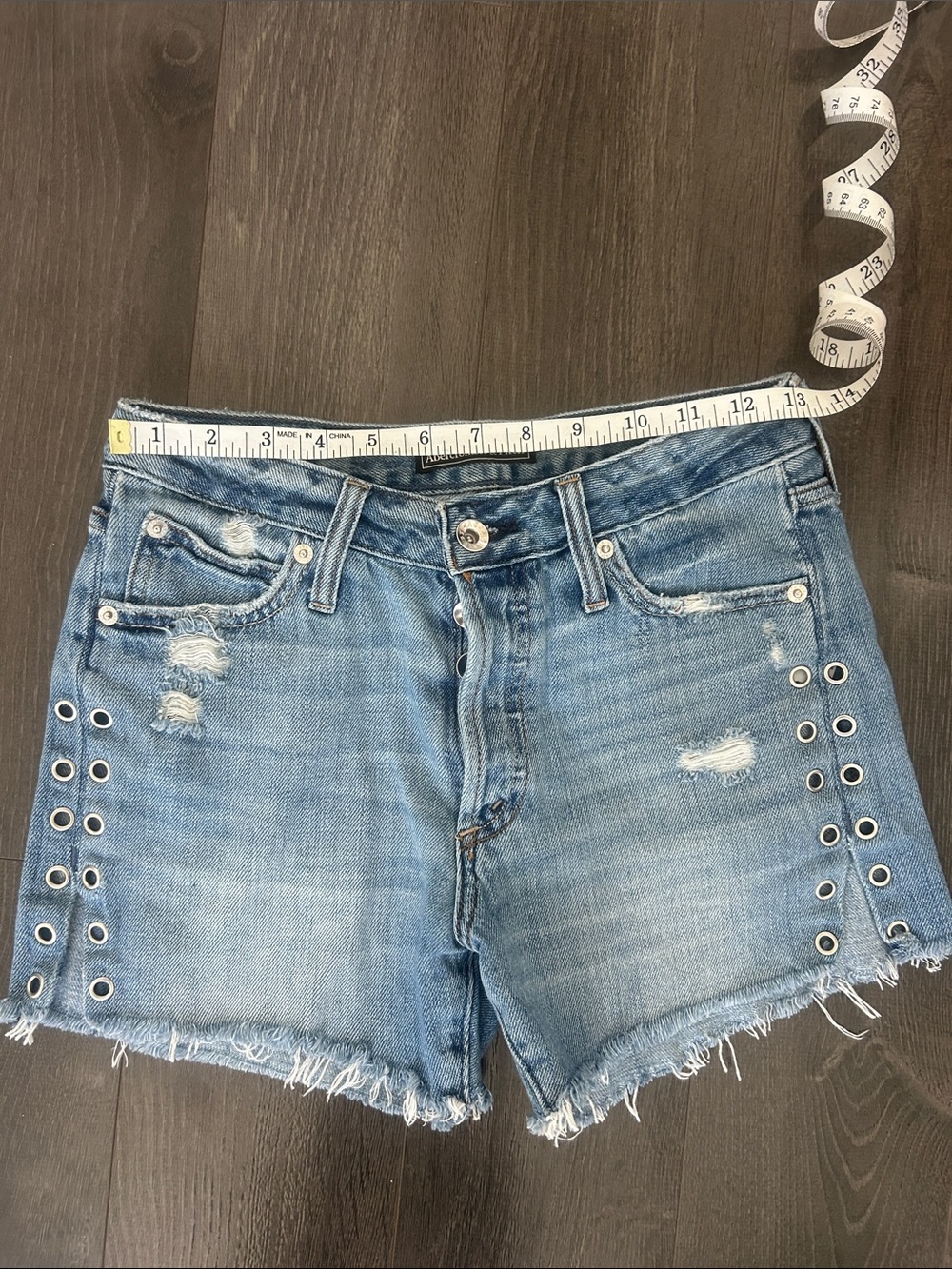 Abercrombie & Fitch Medium Wash Distressed Denim Shorts with Grommet Trim